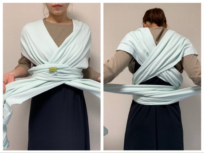 胴回りに巻いた布に、垂らした部分を入れて引っ張ります